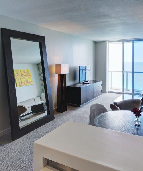Mirror and lounge area in hotel room